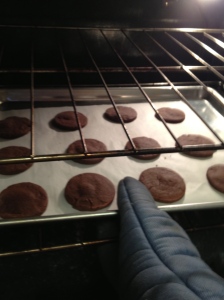 Pulling the crisp cookies out of the oven!